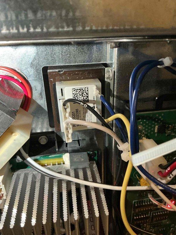 Responded to warranty call for non-operational air conditioning system where thermostat was calling but unit failed to respond. After consultation with technical support and diagnostic testing, identified voltage bleed back issue caused by original 18/8 wiring installation. Replaced wiring with 18/2 wire and rewired the RDS, EIM, and furnace board to eliminate voltage interference. Upon testing AC operation post-rewiring, thermostat experienced power dropout, indicating possible undersized transformer unable to handle system load. Documented findings with photos of HVAC equipment and control panel components. Recommended follow-up visit with senior technician to address transformer capacity issue and complete system commissioning.