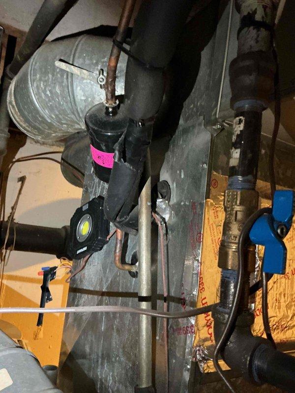 Completed comprehensive tune-up and inspection on aging HVAC system approximately 15-16 years old. Performed full system evaluation including furnace, air handler, ductwork, and associated plumbing components. Inspected all mechanical connections, copper piping, flexible ductwork, and insulation integrity throughout the installation. Verified proper operation of all equipment, checked refrigerant levels, cleaned components as needed, and ensured system is functioning within manufacturer specifications. Documented equipment condition with photographic records and discussed maintenance plan options with homeowner to optimize system performance and longevity.