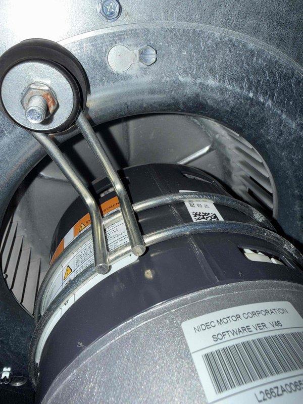 Completed preventative maintenance clean and check on air conditioning and air handler system per service comfort plan. Inspected and verified blower motor operation, confirmed proper mounting and vibration dampening, and documented equipment specifications including Nidec motor assembly. Measured and recorded system temperatures at return air grille, with readings indicating 69.4°F, confirming proper airflow and system performance within normal operating parameters.