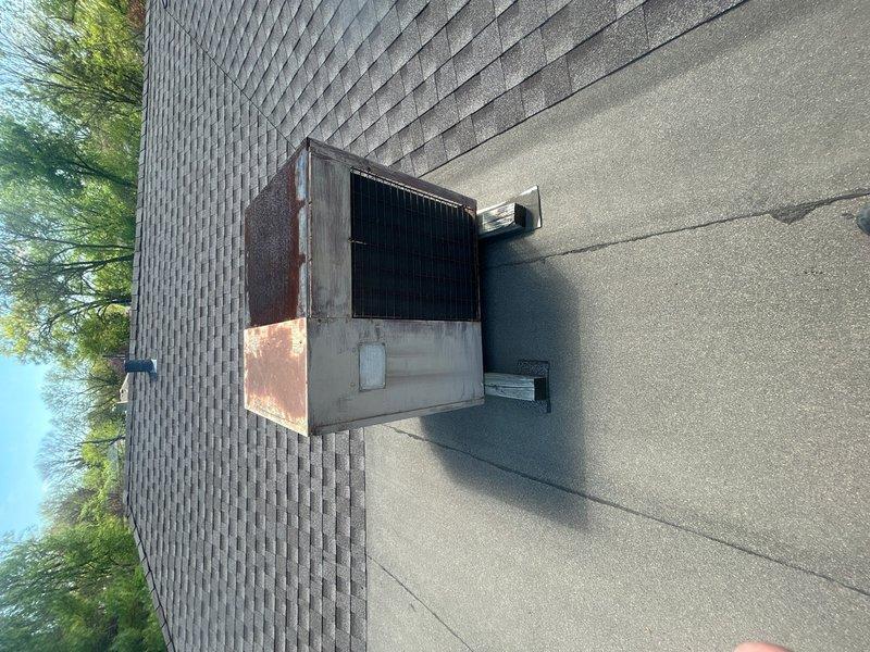 Conducted comprehensive assessment of 40-year-old HVAC system for complete replacement estimate. Evaluated roof-mounted air conditioning condenser unit exhibiting significant rust and corrosion on exterior panels, indicating advanced age and weathering. Inspected crawl space air handler unit and documented existing equipment conditions with photography. Provided replacement recommendations for both outdoor condensing unit and indoor air handler to address obsolete equipment and restore proper system functionality.
