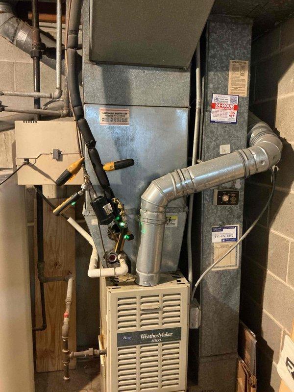 Responded to no cooling complaint on residential WeatherMaker 9200 system with ecobee3 lite thermostat showing 8-degree temperature differential. Performed diagnostic evaluation of furnace and air handler unit in basement mechanical room, inspected ductwork connections and plenum assembly. Documented heavily soiled 16x25x1 air filter with significant particulate buildup restricting airflow, which was identified as primary cause of inadequate cooling performance and reduced system efficiency.