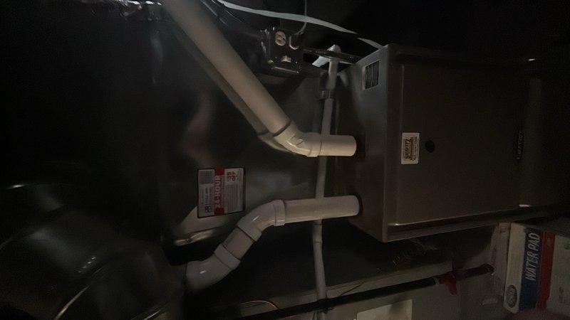 Conducted comprehensive HVAC system assessment for new customer to provide air conditioning replacement estimate. Evaluated existing equipment installation including furnace/air handler unit, condensate drainage system with PVC piping configuration, and ductwork connections in mechanical space. Discussed system replacement options with available promotional incentives and explained standard 10-year parts and labor warranty coverage that accompanies qualifying equipment installations.