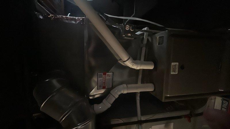 Conducted comprehensive HVAC system assessment for new customer to provide air conditioning replacement estimate. Evaluated existing equipment installation including furnace/air handler unit, condensate drainage system with PVC piping configuration, and ductwork connections in mechanical space. Discussed system replacement options with available promotional incentives and explained standard 10-year parts and labor warranty coverage that accompanies qualifying equipment installations.