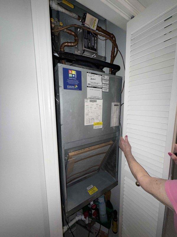 Performed preventive maintenance tune-up on single-system residential air handler unit located in utility closet. Conducted electrical diagnostics using digital clamp meter, recording amperage readings to verify proper system operation. Inspected air handler components, refrigerant lines, and electrical connections to ensure unit is functioning within manufacturer specifications.