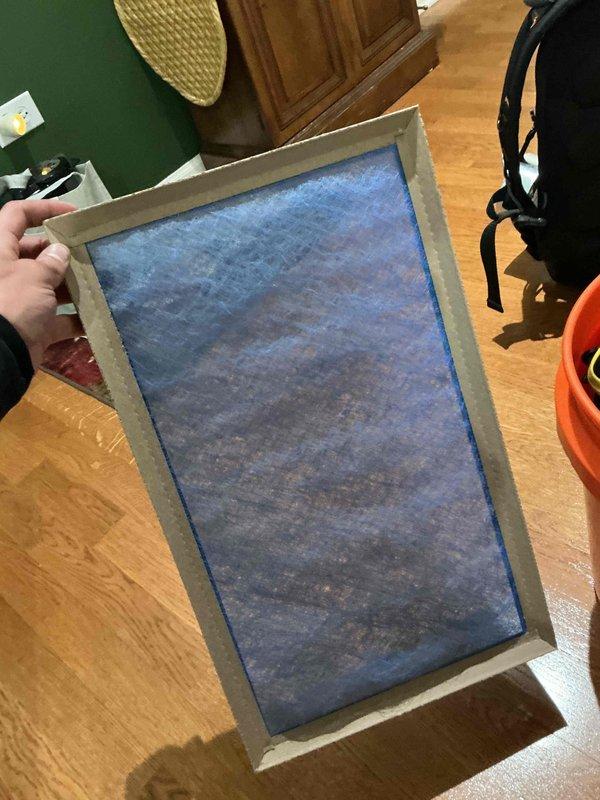 Completed clean and check service on single HVAC system per building specifications. Replaced heavily soiled air filter showing significant dust and debris accumulation throughout the blue fibrous media. Verified thermostat operation and system controls functioning properly.