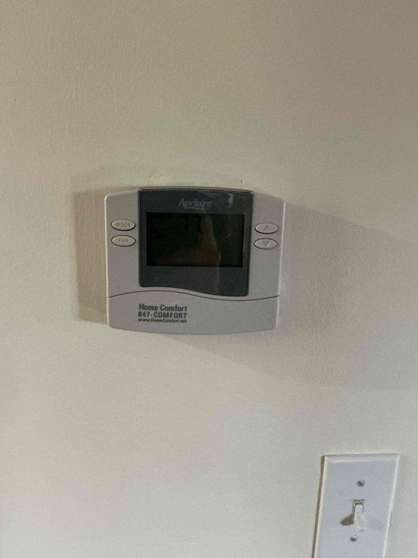 Completed clean and check service on single HVAC system per building specifications. Replaced heavily soiled air filter showing significant dust and debris accumulation throughout the blue fibrous media. Verified thermostat operation and system controls functioning properly.