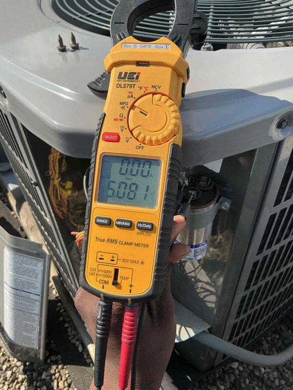 Completed comprehensive tune-up and maintenance service on single HVAC system consisting of outdoor condenser unit and indoor air handler. Performed electrical diagnostics using clamp meter to verify amperage draws and system performance parameters, confirming all readings within manufacturer specifications. System found clean and operating properly; customer declined filter replacement as they maintain their own inventory of filters.