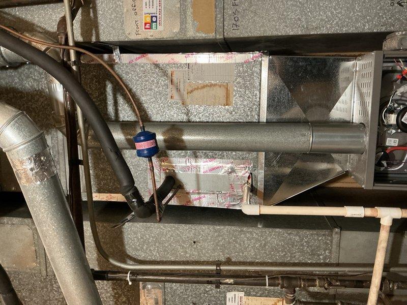 Completed furnace replacement for unit 1703, disconnecting existing forced air furnace and installing new Lennox furnace unit in basement utility area. Connected new furnace to existing supply and return air ductwork with necessary sheet metal transitions, attached to existing gas line, electrical circuit, and exhaust venting. Mounted furnace on wooden platform, secured all ductwork connections with proper insulation, and routed refrigerant lines and condensate piping as required. Performed complete system start-up, tested and adjusted all equipment for proper operation, verified gas pressure and combustion efficiency, and completed comprehensive safety inspection. System is fully operational with 5-year parts warranty and 1-year extended labor warranty in effect. Old furnace left on site per customer request.
