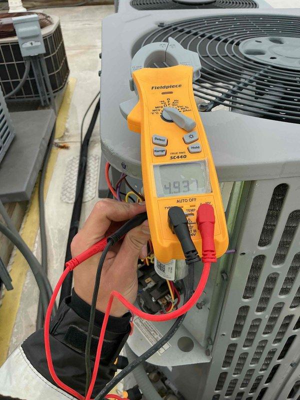 Completed comprehensive tune-up and diagnostic evaluation on single HVAC system per building specifications. Performed electrical measurements and system diagnostics using clamp meter, verifying voltage readings and amperage draw on outdoor condenser unit and indoor air handler components. Customer declined filter replacement at time of service, and applicable processing fee applies for credit card payment if selected.
