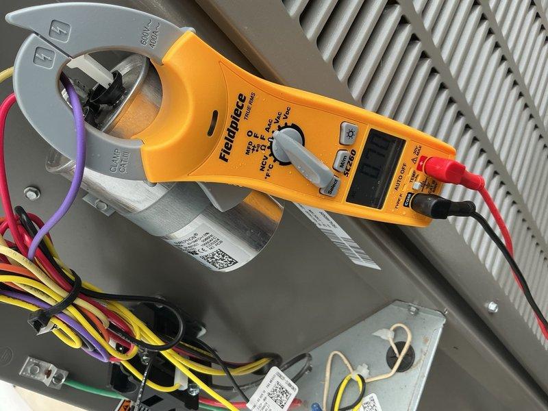 Performed comprehensive Comfort Plan clean and check maintenance on single HVAC system. Conducted electrical diagnostics using clamp meter to measure amperage draw and verify proper system operation. Tested dual run capacitor performance and confirmed all electrical connections were secure with appropriate wire terminations. Measured voltage and current readings on capacitor terminals to ensure component functionality within manufacturer specifications. Inspected control panel components, wiring integrity, and electrical connections throughout system. All tested components operating within normal parameters with no deficiencies noted. System confirmed to be functioning properly upon completion of maintenance visit.