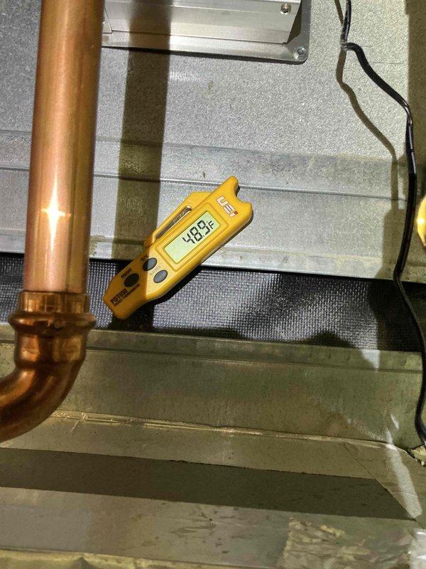 Completed AC/AH Clean and Check per building specifications on single-system air handler unit. Performed standard tune-up maintenance including inspection of all accessible components, copper refrigerant lines, electrical connections, and condensate drain system. Measured supply air temperature at 48.8°F, confirming proper cooling operation. Contacted customer regarding optional filter replacement; no response received, so existing filter was left in place. System operating within normal parameters at time of service completion.