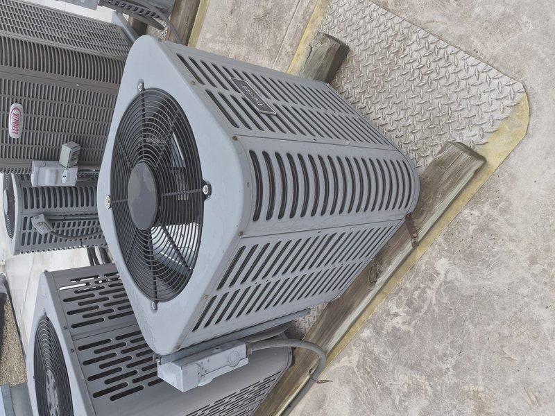 Completed preventative maintenance tune-up on residential cylindrical heat pump system installed on rooftop platform. Performed comprehensive inspection of outdoor condenser unit, verified proper operation of fan motor and blade assembly, checked refrigerant lines and electrical connections, and cleaned condenser coils. System operating within normal parameters with no deficiencies noted at time of service.