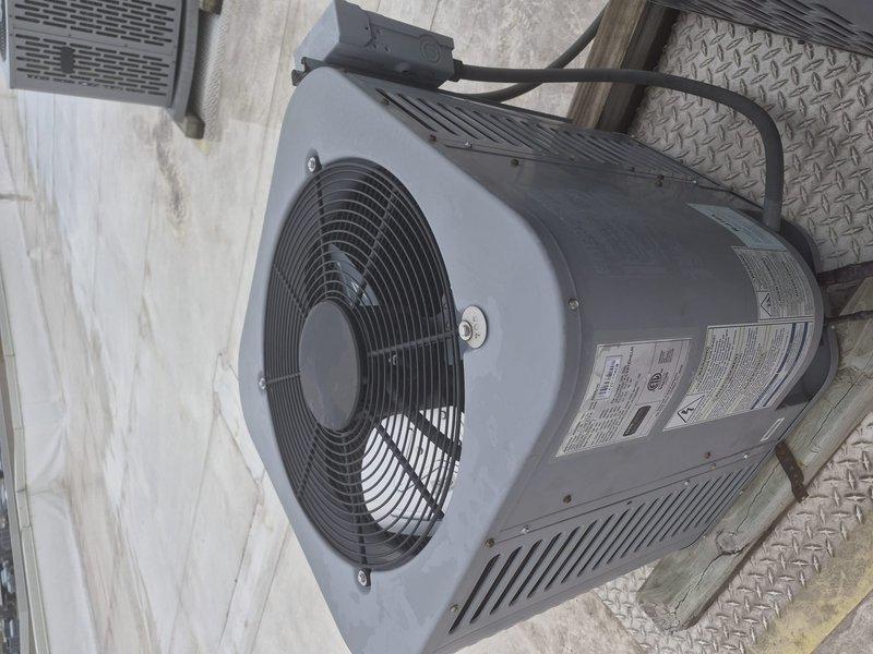 Completed preventative maintenance tune-up on residential cylindrical heat pump system installed on rooftop platform. Performed comprehensive inspection of outdoor condenser unit, verified proper operation of fan motor and blade assembly, checked refrigerant lines and electrical connections, and cleaned condenser coils. System operating within normal parameters with no deficiencies noted at time of service.