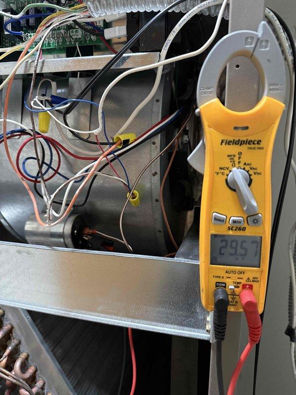 Completed comprehensive tune-up maintenance on single residential HVAC system, performing electrical diagnostics on both indoor air handler and outdoor condenser unit. Measured and verified amperage draw at 29.5 amps on blower motor assembly, inspected all electrical connections and wiring throughout the system, and confirmed proper operation of all mechanical components including condenser fan assembly with copper blade. All components tested within normal operating parameters and system returned to full operational status.