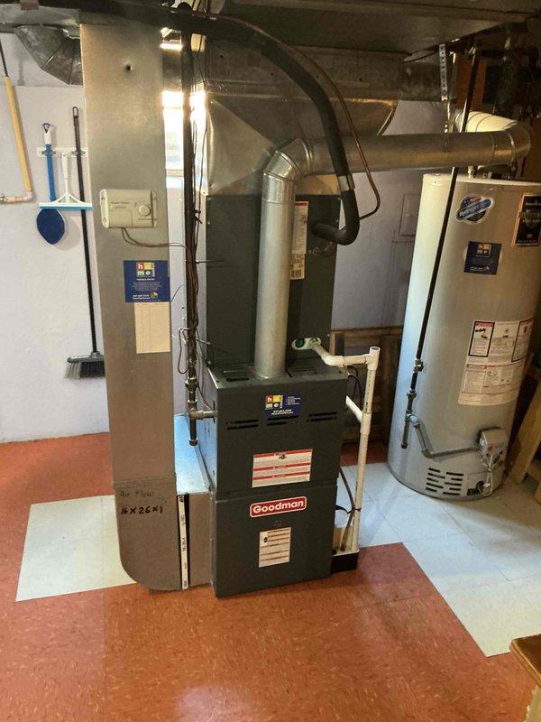 Responded to no heat call at commercial church facility. Inspected Goodman furnace unit in basement mechanical room and identified airflow issues with ductwork system not distributing conditioned air properly. Documented existing HVAC equipment specifications and measurements. Also assessed two water heaters requiring replacement—one located at main church building and another at rectory—and collected equipment model information, dimensions, and installation requirements to prepare replacement quotation for both units.
