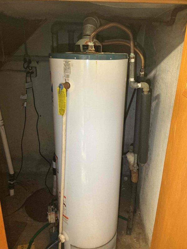 Responded to no heat call at commercial church facility. Inspected Goodman furnace unit in basement mechanical room and identified airflow issues with ductwork system not distributing conditioned air properly. Documented existing HVAC equipment specifications and measurements. Also assessed two water heaters requiring replacement—one located at main church building and another at rectory—and collected equipment model information, dimensions, and installation requirements to prepare replacement quotation for both units.