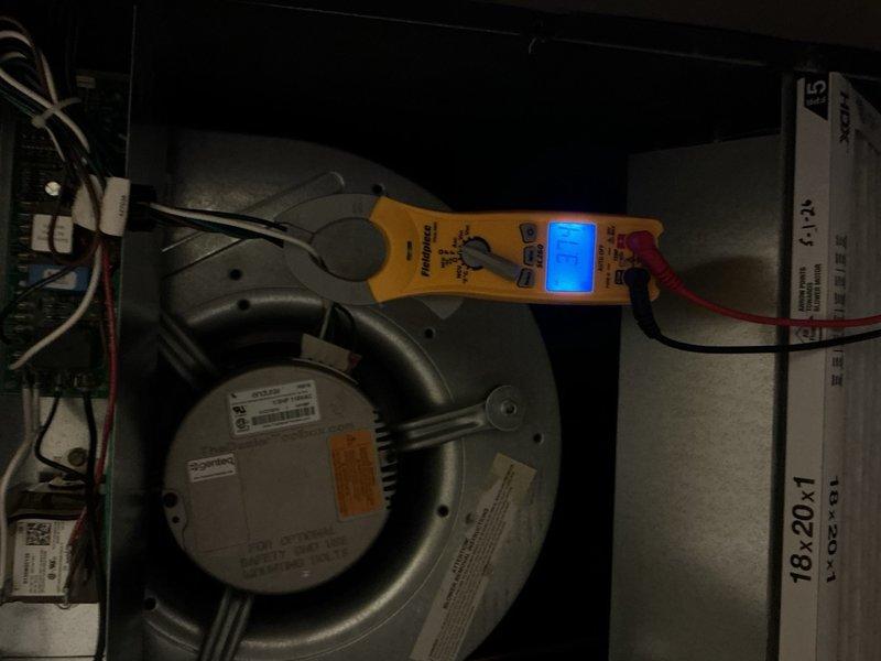 Completed comprehensive tune-up on single-system HVAC unit. Performed standard maintenance procedures including inspection of blower motor assembly, verification of electrical components and capacitor functionality, and diagnostic testing with multimeter to ensure proper voltage and amperage readings. Verified Honeywell thermostat operation showing system maintaining 77°F setpoint. Unit operating within normal parameters with no filter present at time of service.