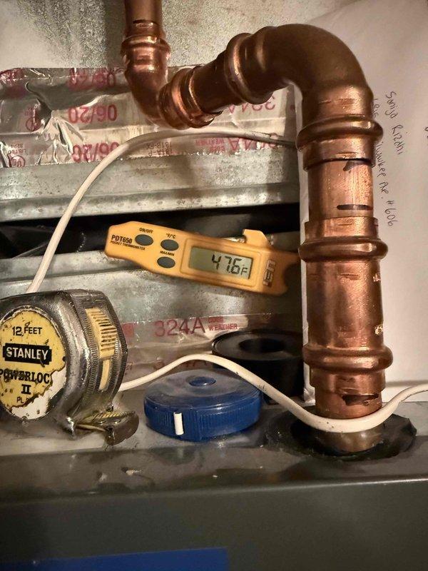 Completed routine maintenance tune-up on single HVAC system. Performed temperature diagnostics at evaporator coil, recording operational readings to verify proper system performance. Inspected coil condition, noting accumulated dust and debris between fins. Measured supply air temperature at 46.4°F, confirming adequate cooling capacity. System currently operating without filter installed; customer notified of missing filter requirement for optimal performance and equipment protection.