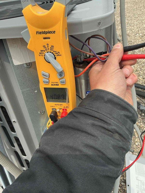 Completed preventive maintenance tune-up on single-system air conditioning unit. Performed electrical diagnostics using digital multimeter, verifying voltage and amperage readings within manufacturer specifications. Inspected evaporator coil and blower wheel assembly, confirming clean operation and proper airflow. All system components operating normally with no deficiencies noted.