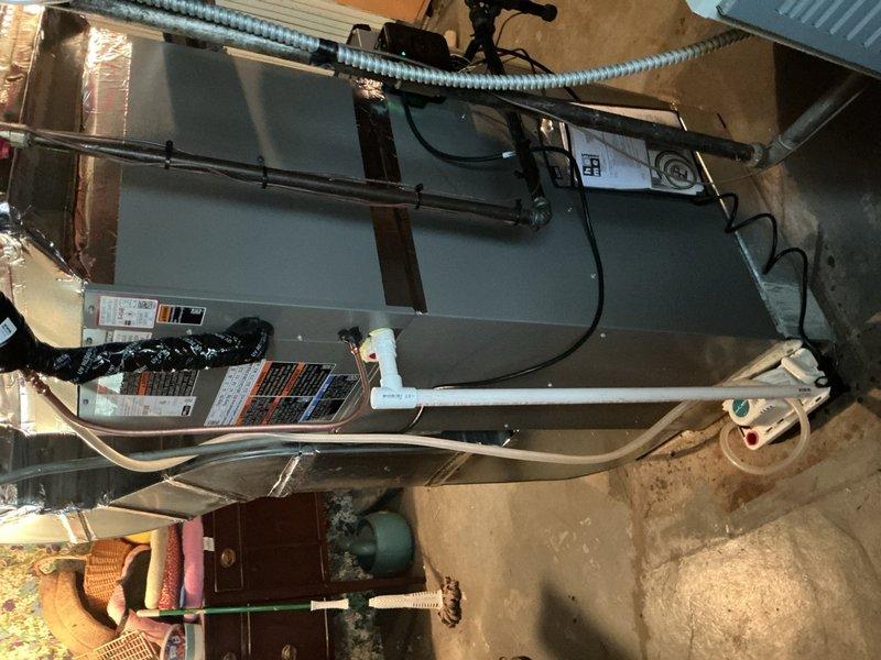 Completed full air conditioning system replacement on first floor unit. Reclaimed existing refrigerant from old condenser, evaporator coil, and line-set, then disconnected and removed all obsolete equipment. Installed new Lennox 2-ton 18 SEER2 variable speed condensing unit (Model EL18KCV-024-230) on new equipment pad and mounted matching evaporator coil in air handler. Connected new coil to existing copper refrigerant lines, evacuated system to remove moisture and air, then charged with R454B refrigerant to manufacturer specifications. Installed Lennox S40 communicating thermostat with Wi-Fi capability and touchscreen interface, configured for system communication and programmed for optimal operation. Installed refrigerant detection system (RDS) as required safety mitigation measure. Performed complete system start-up, tested all components for proper operation, verified airflow and temperature differential, and conducted comprehensive safety inspection. System operating within manufa