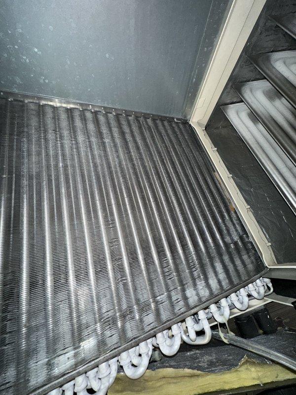 Responded to service call for loud furnace operation in commercial HVAC system. Upon inspection, investigated evaporator coil assembly and air handler unit to identify source of excessive noise. Performed diagnostic assessment of coil mounting, internal clearances, and component positioning within the air handler cabinet. Measured critical spacing dimensions to verify proper installation tolerances and identify potential contact points causing operational noise. Examined wire harness routing and securing to ensure electrical components were not contributing to vibration or noise issues. Assessed condition of evaporator coil fins, mounting brackets, and drain pan supports for proper alignment and secure attachment. Troubleshot mechanical components and verified adequate clearance between coil assembly and cabinet walls to prevent rattling or vibration transfer during system operation. Identified and resolved clearance issue causing noise complaint, ensuring all components properly secur
