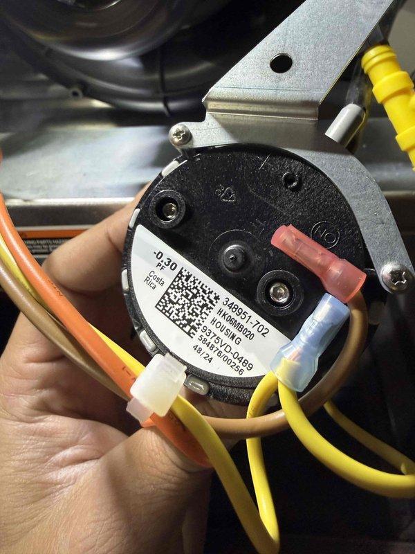 Responded to no power condition at thermostat with red wire not receiving voltage. Performed diagnostic testing on HVAC system electrical components and traced power supply from equipment to thermostat control circuit. Inspected blower assembly motor connections and wiring harness for continuity issues. Identified faulty pressure switch preventing 24V power from reaching thermostat red wire terminal. Removed defective pressure switch, verified proper voltage supply, and installed replacement pressure switch. Reconnected all wiring to appropriate terminals, secured connections, and tested system operation. Confirmed thermostat now receiving proper 24V power supply and system responding correctly to temperature calls.