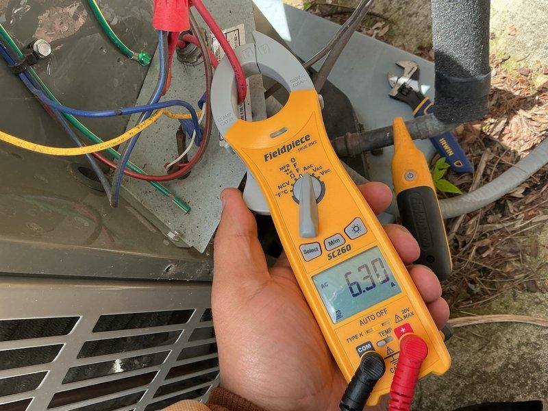 Completed annual air conditioning clean and check per Gold Comfort Plan maintenance agreement. Performed comprehensive system inspection including electrical connections, contactor operation, and amperage readings. Measured compressor amperage at 6.36 amps, which is within normal operating parameters. Verified all wire connections are secure and properly terminated at contactor and equipment terminals. System operating efficiently with no deficiencies noted.