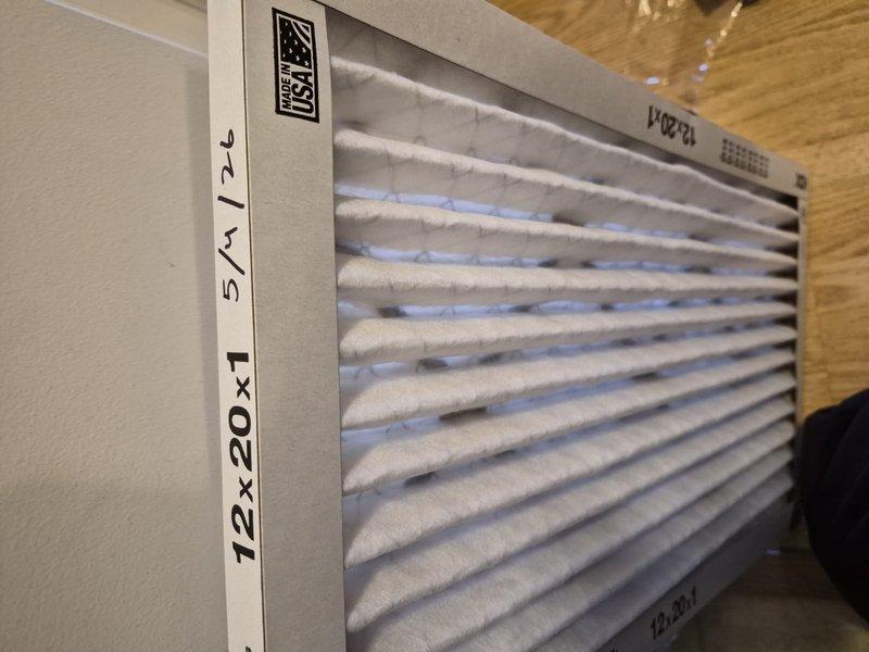 Completed preventative maintenance on air conditioning and air handler system per building special requirements. Installed new 14x20x1 pleated air filter in return air grille. Verified thermostat operation showing 77°F with system controls functioning properly in cooling mode with auto fan setting.