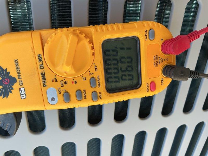 # HVAC Tune-Up Summary

Performed comprehensive tune-up and inspection on single-system air conditioning unit. Conducted electrical diagnostics using digital multimeter to verify proper voltage and amperage at heat exchanger and condenser components. Inspected outdoor condensing unit, noting moderate weathering and corrosion on contactor mounting bracket and frame assembly. Verified contactor operation and electrical connections remain functional despite age-related oxidation. Documented equipment condition through photographs. Offered optional filter replacement to customer. System operational upon completion of preventive maintenance service.