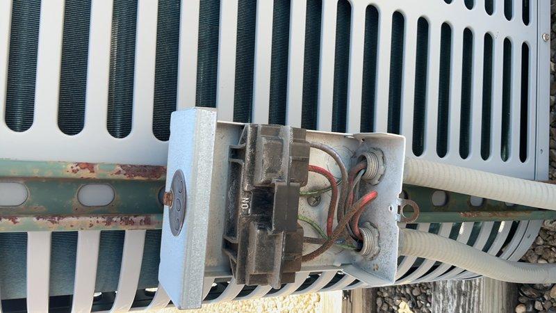 # HVAC Tune-Up Summary

Performed comprehensive tune-up and inspection on single-system air conditioning unit. Conducted electrical diagnostics using digital multimeter to verify proper voltage and amperage at heat exchanger and condenser components. Inspected outdoor condensing unit, noting moderate weathering and corrosion on contactor mounting bracket and frame assembly. Verified contactor operation and electrical connections remain functional despite age-related oxidation. Documented equipment condition through photographs. Offered optional filter replacement to customer. System operational upon completion of preventive maintenance service.