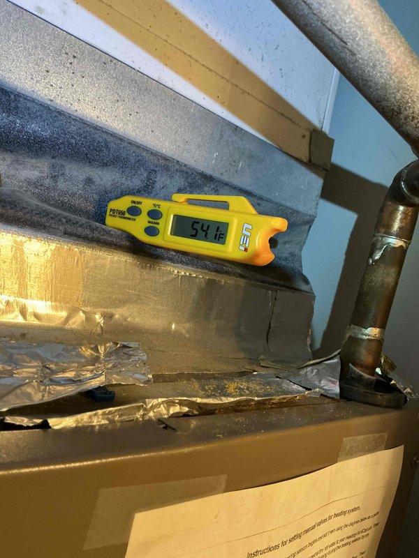 Completed comprehensive air conditioning maintenance and tune-up service per building special requirements. Performed electrical diagnostics on outdoor condensing unit using clamp meter, recording amperage readings of 5.79 amps and verifying proper operation of capacitor and electrical connections. Measured supply air temperature at indoor air handler registering 54.1°F, confirming adequate cooling performance and proper refrigerant charge. Installed customer-requested 16x20x1 air filter to maintain optimal airflow and system efficiency.
