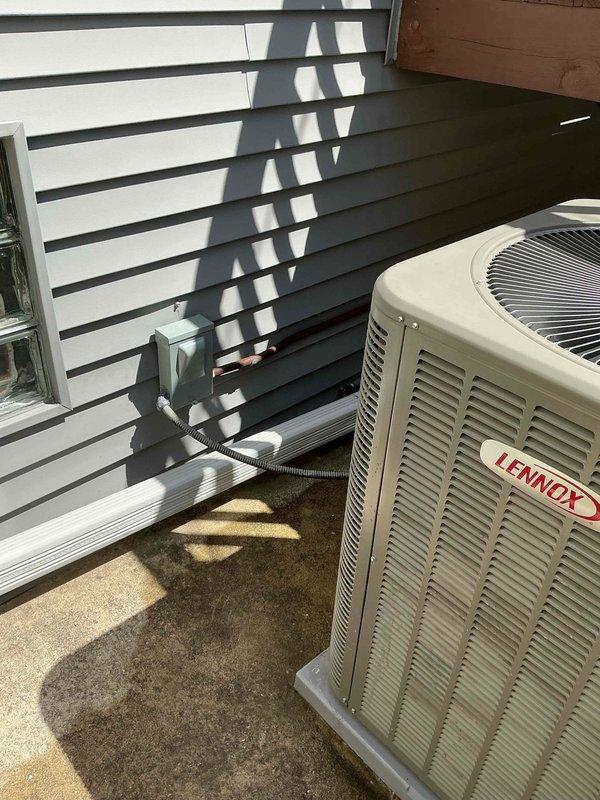 Completed electrical upgrade for residential HVAC system by installing a new disconnect box for the air conditioning condenser unit and a dedicated GFCI electrical outlet for the humidifier. All components were properly mounted and wired to ensure safe operation and code compliance for both the cooling system and humidity control equipment.