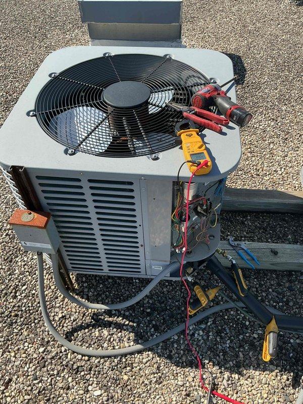 Performed comprehensive preventive maintenance on single-system air conditioning unit per building specifications. Conducted diagnostic testing of outdoor condenser unit including electrical measurements using TRMS clamp meter and multimeter to verify proper amperage draw and voltage levels across all circuits. Inspected condenser coil, fan motor operation, and refrigerant line connections. All electrical connections tested and confirmed within manufacturer specifications. Unit operational and running efficiently upon completion of maintenance procedures.