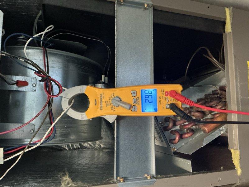 Completed comprehensive A/C and air handler maintenance per building specifications, including installation of 14x20x1 filter. Performed electrical diagnostics using digital multimeter, verifying capacitor readings at 20.9 µF within acceptable range. Inspected blower motor assembly, fan guard, and all system components, confirming proper operation and cleanliness of unit with no issues identified.