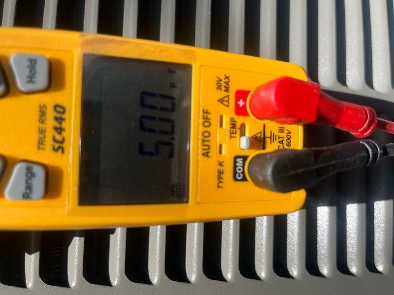 Completed Comfort Plan preventive maintenance on single-system air conditioning unit. Performed comprehensive clean and check inspection including visual assessment of air handler and ductwork, which revealed significant dust and debris accumulation on return air ductwork and cabinet surfaces. Verified system operational status and took temperature measurements using calibrated digital multimeter to assess performance parameters. Unit confirmed operational at time of service with customer reporting no current issues. Documented equipment condition through photographic records showing dust buildup on galvanized ductwork and HVAC cabinet requiring attention during routine maintenance cycle.