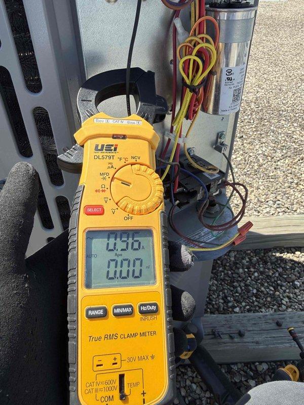 Performed comprehensive tune-up and diagnostic evaluation on single HVAC system per building specifications. Conducted electrical measurements using clamp meter, recording compressor amperage at 4.50A and fan motor draw at 6.12A, both within manufacturer specifications. Inspected capacitor connections, verified proper wire terminations, and confirmed all electrical components operating safely under rated voltage parameters.