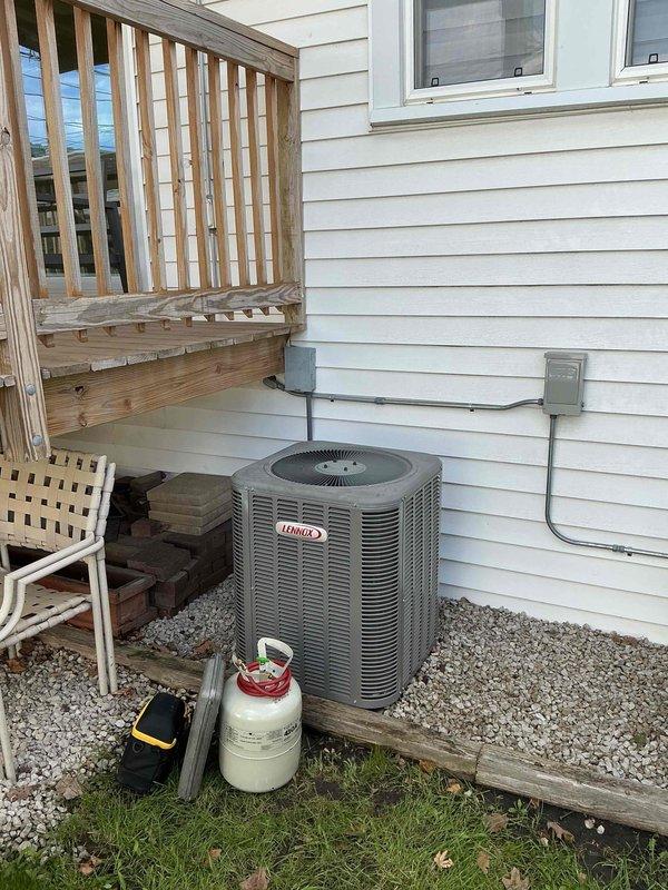 Performed comprehensive clean and check maintenance on Lennox air conditioning system and air handler per Comfort Plan agreement. Conducted electrical diagnostics using digital multimeter, verified system operation and performance readings, and serviced outdoor condenser unit. Additionally turned off pilot light on boiler as requested for seasonal shutdown.