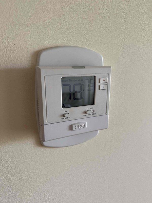 Responded to callback for non-operational HVAC unit with humming noise. Upon arrival, verified thermostat was set to cooling mode at 78°F but system was not functioning properly. Diagnosed failed capacitor causing compressor to hum without starting. Replaced defective run capacitor and tested system operation. Confirmed proper amp draw and temperature differential of 22.4°F at supply register. System restored to normal cooling operation and all functions verified operational before departure.