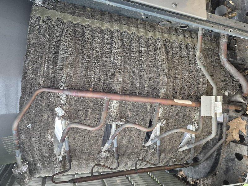 Completed spring clean and check maintenance on air conditioning system per comfort plan agreement. Inspected evaporator coil and found heavy dust and debris accumulation on fins with visible corrosion on copper refrigerant lines. Inspected air filter showing significant dust buildup and discoloration indicating replacement needed. Performed thorough cleaning of evaporator coil assembly, removed dust and lint from fins, checked refrigerant line connections and mounting brackets, and documented system condition with photos. System operational upon completion of maintenance service.