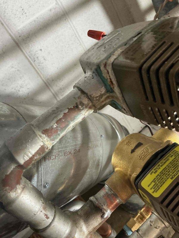 Replaced defective Taco zone valve head and body serving the second floor heating zone. Performed sweating and soldering of copper connections using torch, flux, and 3/4" copper pipe with slip coupling to complete installation. System tested and verified operational upon completion.