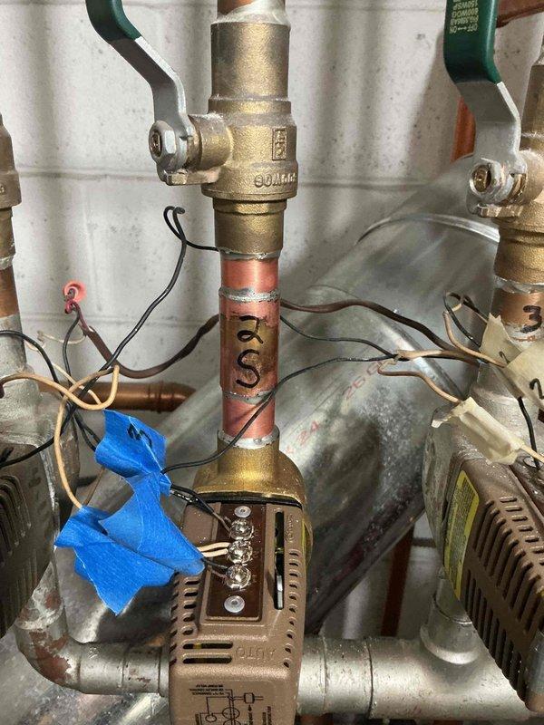 Replaced defective Taco zone valve head and body serving the second floor heating zone. Performed sweating and soldering of copper connections using torch, flux, and 3/4" copper pipe with slip coupling to complete installation. System tested and verified operational upon completion.