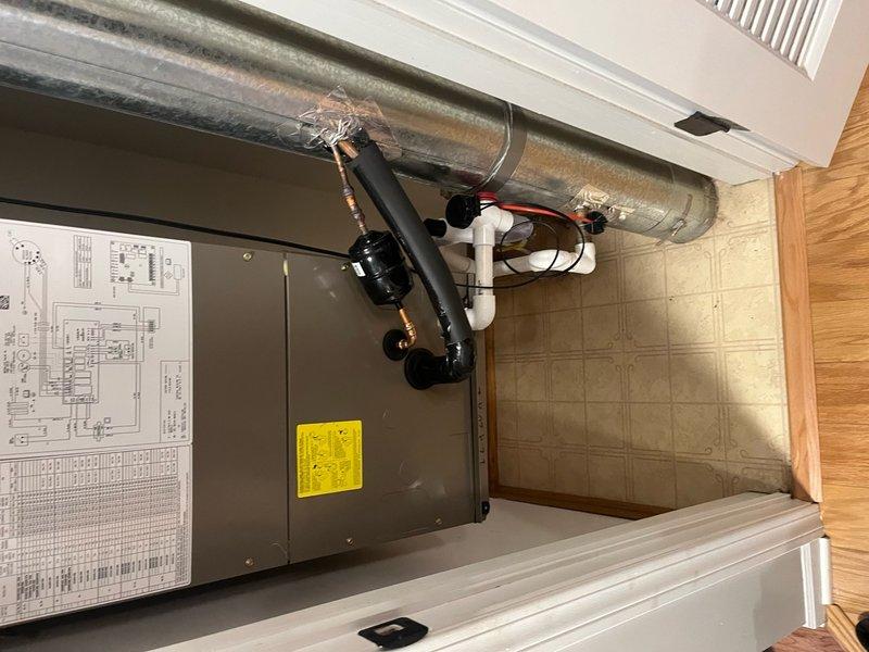 Completed full HVAC system replacement including removal and proper disposal of existing A/C condenser per EPA guidelines and installation of new Lennox 13 SEER2 ML13KC1-018-230 1.5 ton condensing unit on roof. Flushed existing copper lineset, connected new condenser to system, evacuated lines to remove moisture and air, and charged system with R454b refrigerant. Removed existing air handler with hydronic coil from mechanical closet and installed new ADP 1.5-2.0 ton air handler with hydronic coil. Fabricated and installed necessary sheet metal transitions to connect new air handler to existing supply and return ductwork. Connected unit to existing electrical service. Installed new Honeywell T4 thermostat and EZ trap condensate drain system. Performed complete system startup, testing, and final adjustments to ensure proper operation of entire HVAC system.