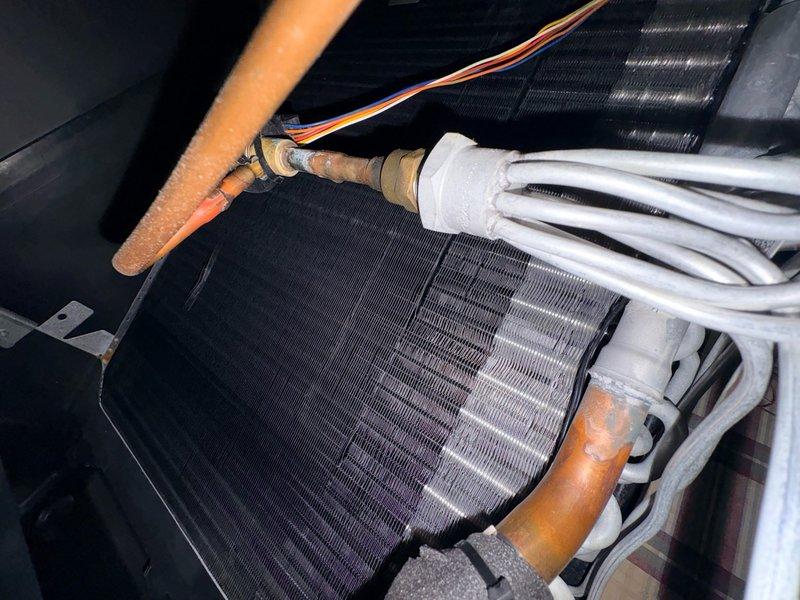 Completed Comfort Plan clean and check on cooling system per maintenance agreement. Performed thorough inspection of evaporator coil and refrigerant lines, noting some surface oxidation on copper piping but no active leaks detected. Measured and recorded system amperage at 5.45 amps, which is within normal operating parameters. Delivered and collected payment for three 20x22x1 air filters as requested. System operating properly with no immediate service needs identified.