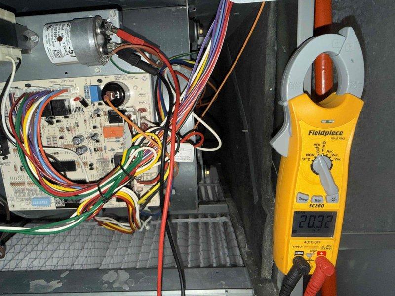 Completed annual air conditioning clean and check maintenance per service comfort plan. Thoroughly cleaned evaporator coil, verified electrical connections and control board operation, and measured system amperage at 20.32 amps indicating proper compressor function. All components tested within normal operating parameters and system left in optimal working condition.