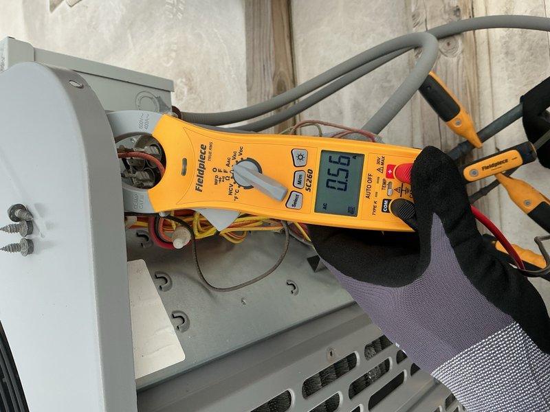 Completed comprehensive Comfort Plan clean and check service on single HVAC system including air handler and outdoor condensing unit. Performed electrical diagnostics using digital multimeter to verify proper voltage and amperage readings at outdoor unit components, tested capacitor function, and inspected all electrical connections and wiring for safety and proper operation. System operating within normal parameters upon completion of maintenance service.