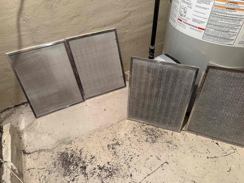Completed spring clean and check on air conditioning system per comfort plan maintenance agreement. Removed and cleaned multiple HVAC air filters found in basement utility area, serviced return air grilles, and performed standard preventative maintenance inspection on cooling equipment. All components checked and system operating within normal parameters.