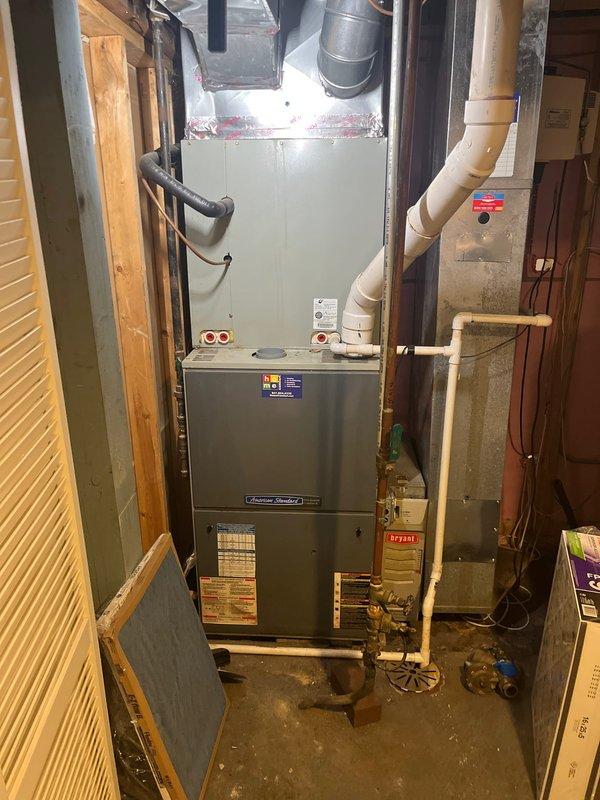 Conducted on-site evaluation of existing HVAC system and water heater for potential replacement. Assessed current furnace installation, ductwork configuration, and associated mechanical components in utility space. Documented existing equipment conditions, including gas connections, condensate drainage lines, electrical wiring pathways, and venting systems to provide comprehensive replacement estimate and recommendations for upgrading residential heating and water heating equipment.