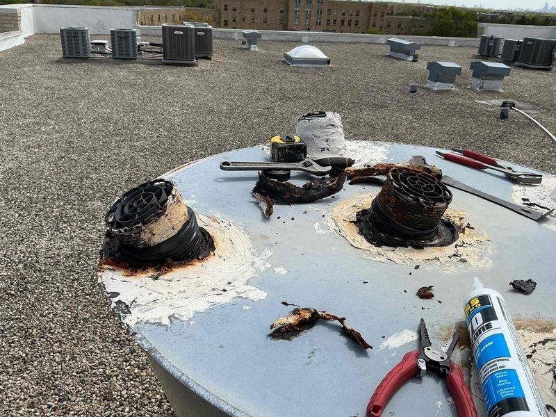 Responded to rooftop service call to address loose and deteriorating boiler flue pipe connections. Upon inspection, found three flue penetrations with compromised weatherproofing, extensive rust staining around mounting points, and degraded sealant material allowing potential water infiltration and exhaust gas leakage. Resecured all flue pipe connections, cleaned rust deposits from affected areas, and applied fresh weatherproof sealant around all penetration points to restore proper seal integrity. Verified all vent caps were properly seated and secured to prevent future displacement. System tested and confirmed proper draft operation with no exhaust leaks detected.