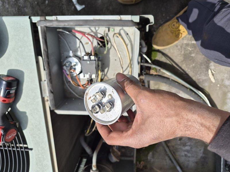 Responded to commercial facility for multiple HVAC equipment failures. Diagnosed and replaced four failed capacitors across multiple systems: dual run capacitor (45+5 MFD) on second floor classroom compressor unit, blower capacitor on twin furnace right-hand unit, 7.5 MFD capacitor on rear rooftop AC unit, and 7.5 MFD blower capacitor on second floor classroom air handler. All capacitors tested out of acceptable range and showed visible signs of corrosion and deterioration. Cleaned blower fan on twin furnace unit as needed. Verified proper operation of all systems following component replacement. All units restored to normal operating condition.