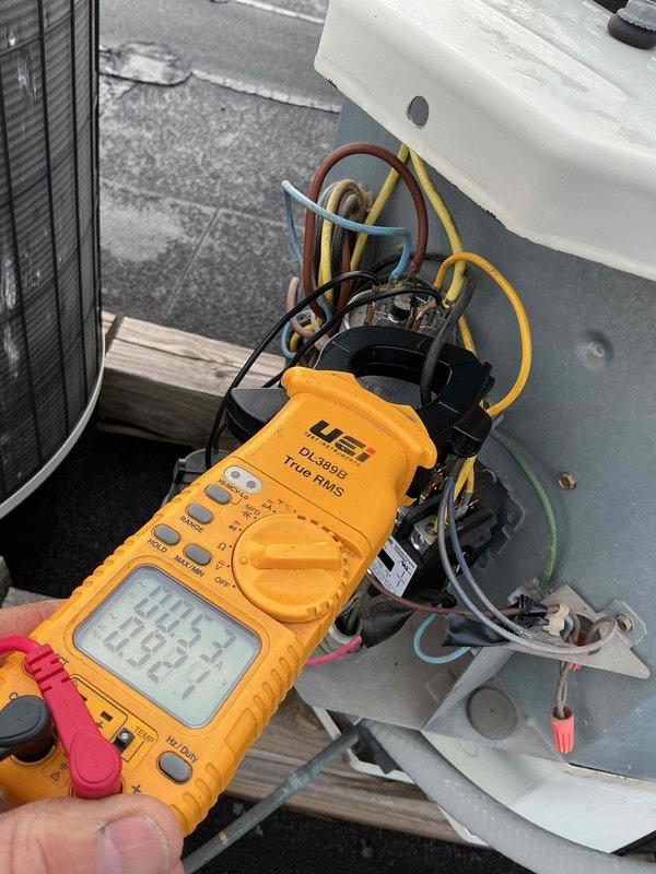 Completed follow-up maintenance visit to access rooftop air conditioning unit that was previously inaccessible. Performed electrical diagnostics on outdoor condensing unit using digital multimeter to test capacitor and associated electrical components. Verified thermostat operation and system settings, confirming unit was in off mode with fan set to auto at time of inspection. Documented equipment conditions with photos for estimate preparation and communicated findings as requested.